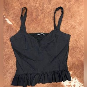 Black peplum style top
